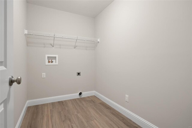 4947 Butler Hill Rd, Saint Louis, MO 63128 - washroom featuring electric dryer hookup, light wood-style floors, hookup for a washing machine, and baseboards