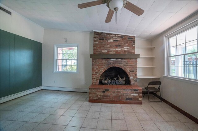 400 W W, New London, MO 63459 - unfurnished living room featuring crown molding, plenty of natural light, a baseboard radiator, tile patterned floors, and a fireplace
