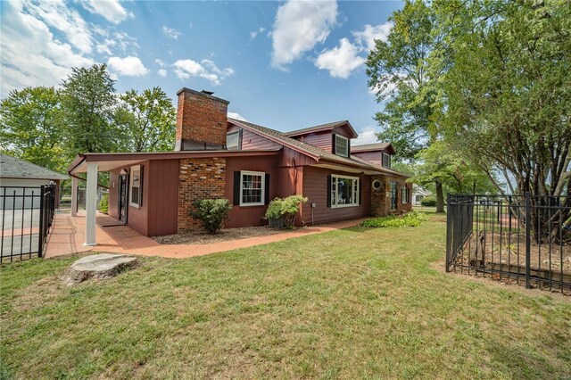 400 W W, New London, MO 63459 - rear view of house with a chimney and a patio