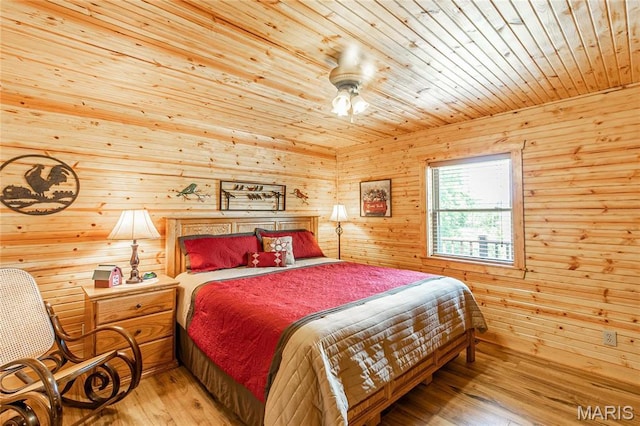 1901 River Valley Rd, Doniphan, MO 63935 - bedroom with wood ceiling, wood walls, wood-type flooring, and a ceiling fan