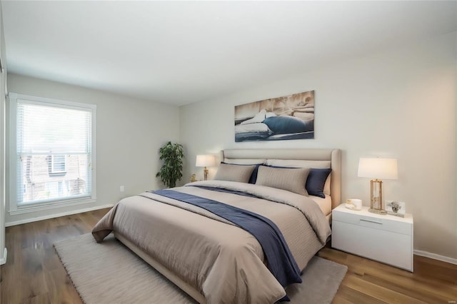 13579 Coliseum Dr Unit G, Chesterfield, MO 63017 - bedroom featuring baseboards and wood finished floors
