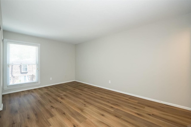 13579 Coliseum Dr Unit G, Chesterfield, MO 63017 - spare room with wood finished floors and baseboards