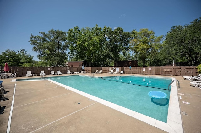 13579 Coliseum Dr Unit G, Chesterfield, MO 63017 - community pool with fence, a patio, and view of scattered trees