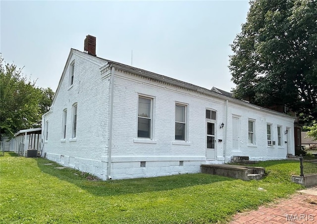 410 N Main St, Red Bud, IL 62278 - view of front of house with a chimney, brick siding, a front lawn, crawl space, and central air condition unit