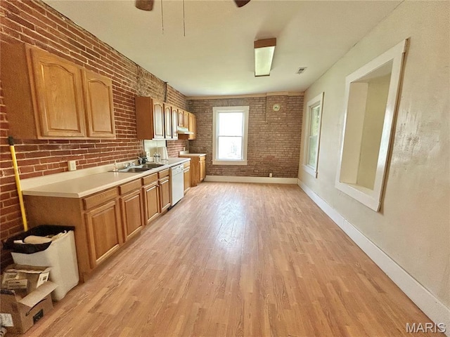 410 N Main St, Red Bud, IL 62278 - kitchen featuring a sink, light countertops, light wood-style flooring, brick wall, and baseboards