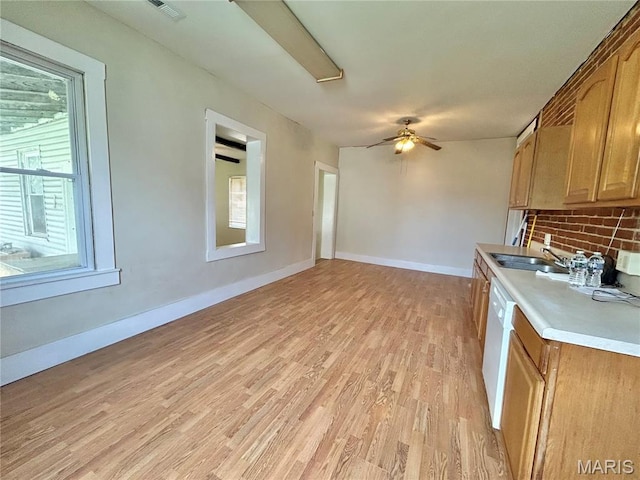 410 N Main St, Red Bud, IL 62278 - kitchen with light wood finished floors, light countertops, ceiling fan, a sink, and baseboards