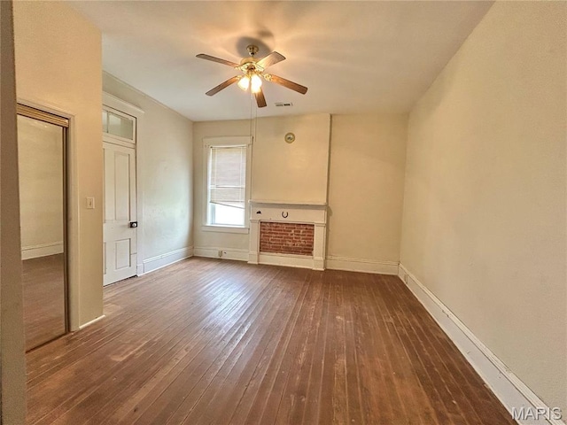 410 N Main St, Red Bud, IL 62278 - unfurnished living room with ceiling fan, wood-type flooring, and baseboards