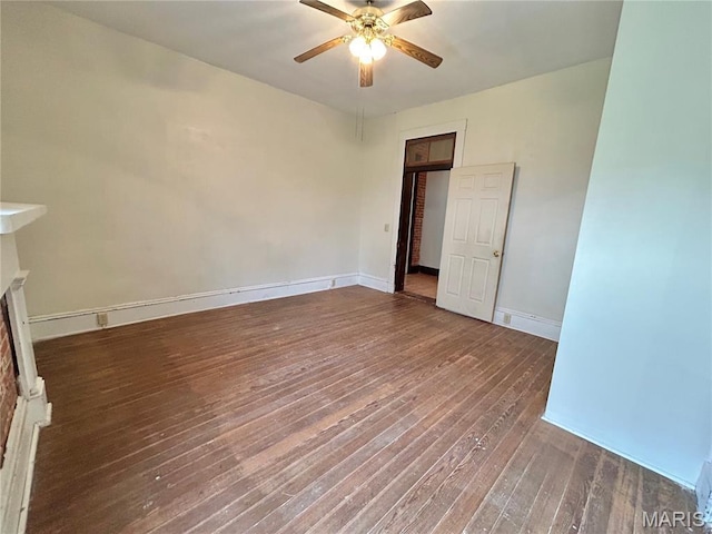 410 N Main St, Red Bud, IL 62278 - empty room featuring ceiling fan, hardwood / wood-style floors, and baseboards