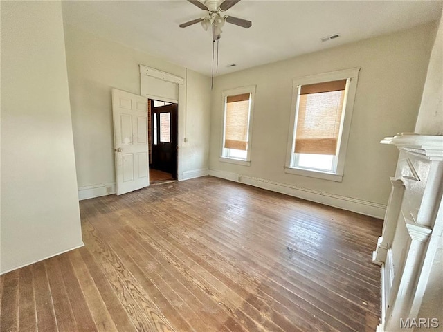 410 N Main St, Red Bud, IL 62278 - unfurnished living room with wood finished floors, a ceiling fan, baseboards, and a baseboard radiator