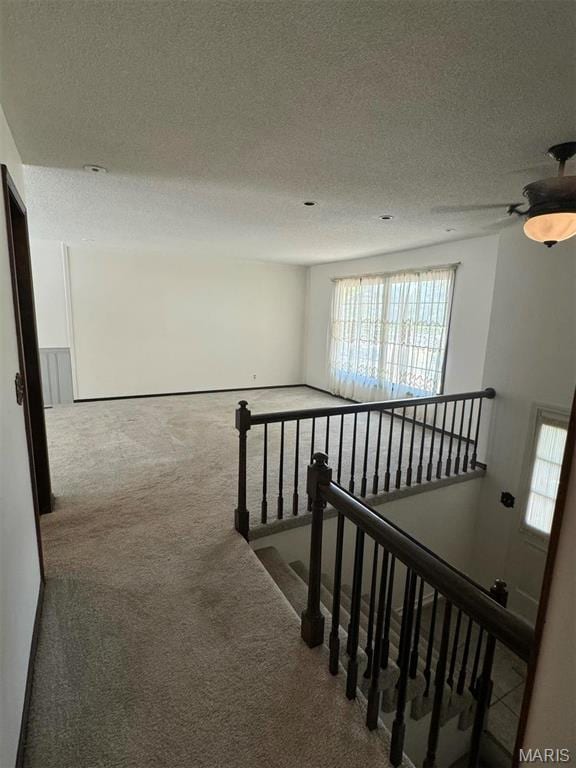 15164 Orchard Lake Dr, Dexter, MO 63841 - corridor with carpet, an upstairs landing, and a textured ceiling
