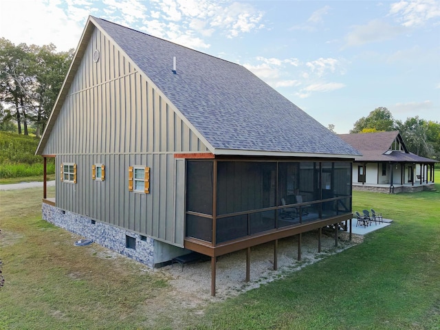 347 Big Trout Trl, Mammoth Spring, AR 72554 - back of house featuring board and batten siding, a lawn, a sunroom, roof with shingles, and crawl space