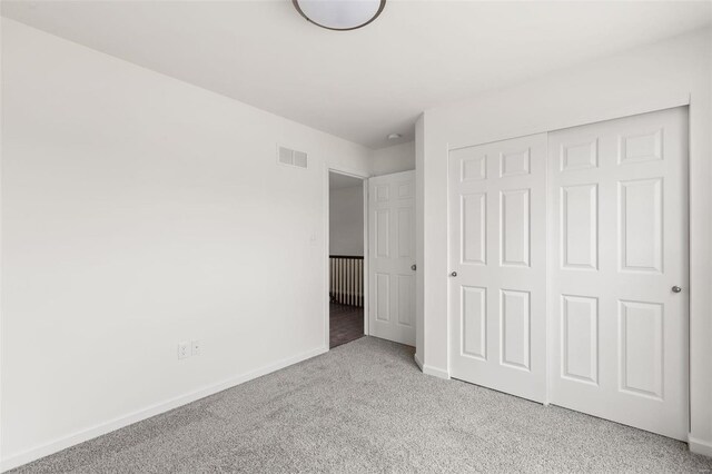 106 Harrow Dr, Ofallon, MO 63385 - unfurnished bedroom with carpet floors, baseboards, and a closet