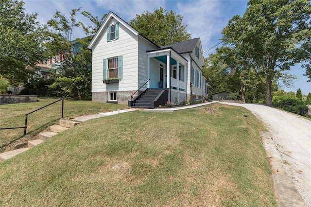 371 Jefferson St, Saint Genevieve, MO 63670 - bungalow featuring a front lawn, a porch, and driveway