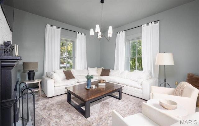 725 W Springfield St, St James, MO 65559 - living room featuring healthy amount of natural light and a chandelier