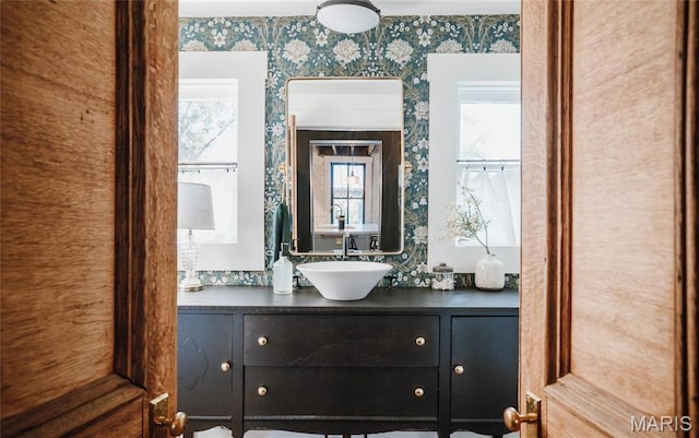 725 W Springfield St, St James, MO 65559 - bathroom with wallpapered walls and vanity