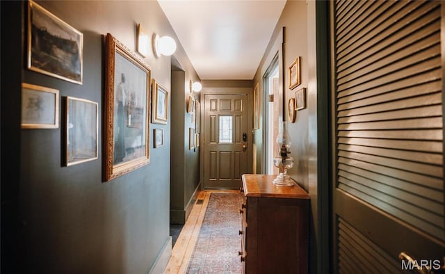 725 W Springfield St, St James, MO 65559 - entryway featuring wood finished floors and baseboards