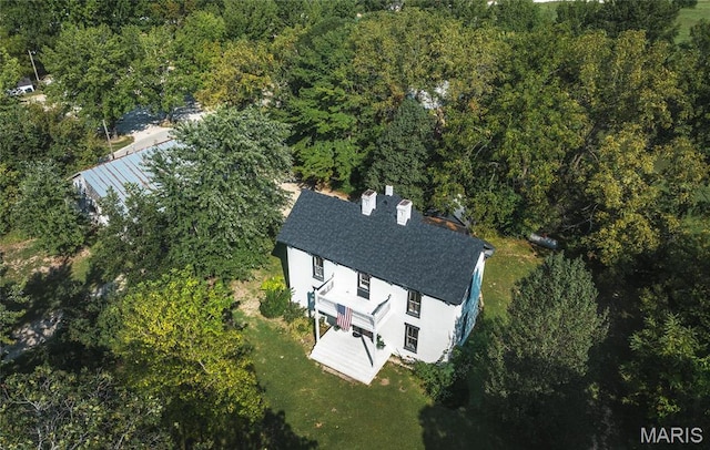 725 W Springfield St, St James, MO 65559 - aerial view of property and surrounding area with a heavily wooded area