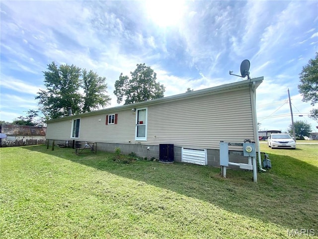 610 N Caldwell St, Middletown, MO 63359 - back of property with a lawn and cooling unit