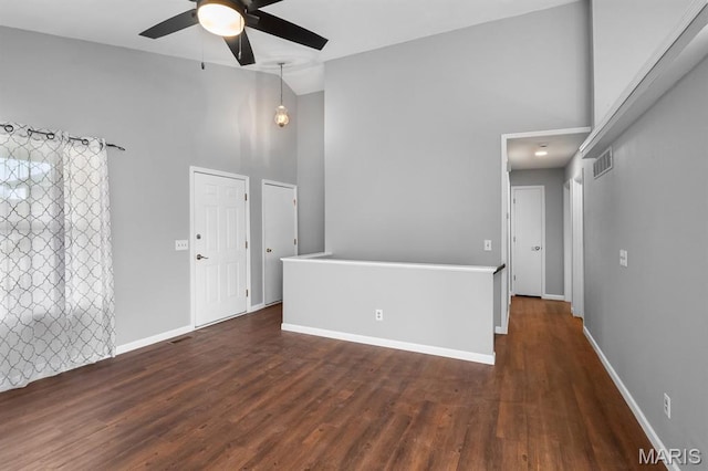 111 Aspencade Cir, Saint Peters, MO 63376 - empty room with high vaulted ceiling, ceiling fan, dark wood-style flooring, and baseboards