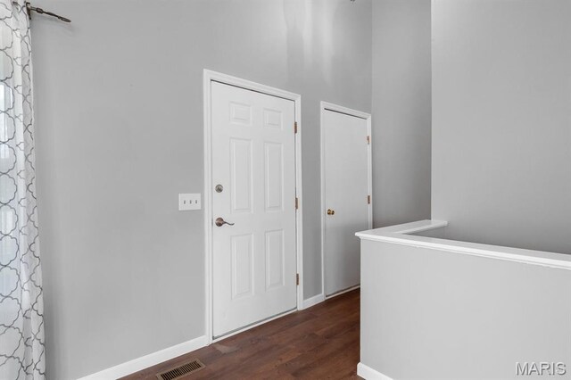 111 Aspencade Cir, Saint Peters, MO 63376 - hallway featuring dark wood-type flooring and baseboards