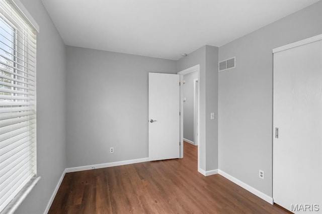 111 Aspencade Cir, Saint Peters, MO 63376 - unfurnished bedroom with wood finished floors, baseboards, and a closet