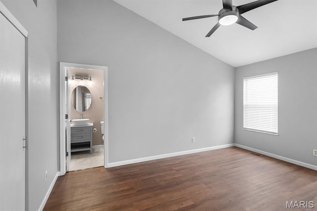 111 Aspencade Cir, Saint Peters, MO 63376 - unfurnished bedroom with a sink, dark wood finished floors, baseboards, high vaulted ceiling, and ensuite bath