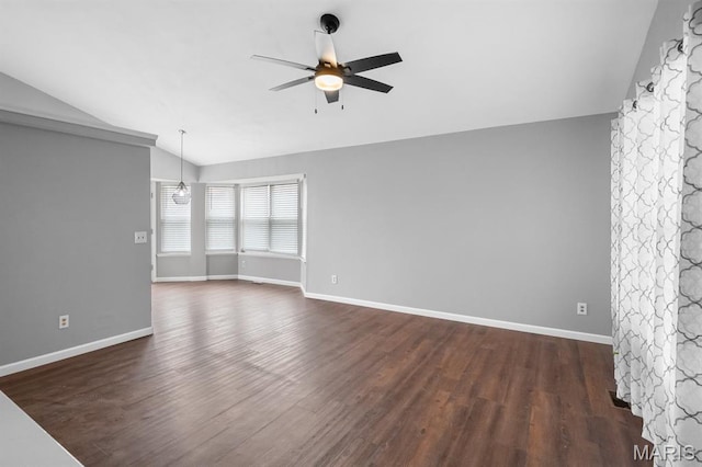 111 Aspencade Cir, Saint Peters, MO 63376 - unfurnished room with vaulted ceiling, a ceiling fan, dark wood-style flooring, and baseboards