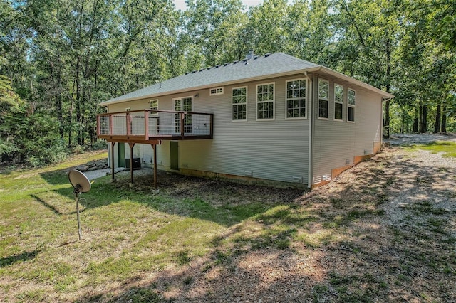 28 Acacia Dr, Conway, MO 65632 - back of property with a lawn, a wooden deck, and central AC