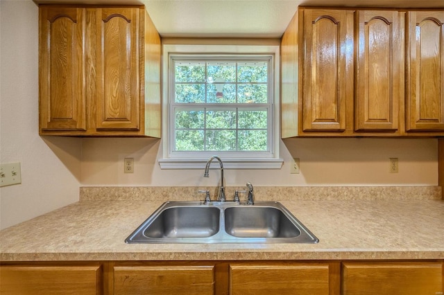 28 Acacia Dr, Conway, MO 65632 - kitchen featuring a sink, brown cabinets, and light countertops