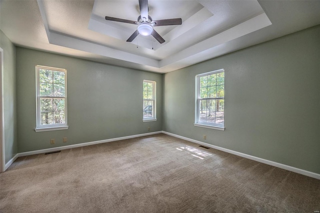 28 Acacia Dr, Conway, MO 65632 - carpeted spare room featuring a raised ceiling, baseboards, and ceiling fan
