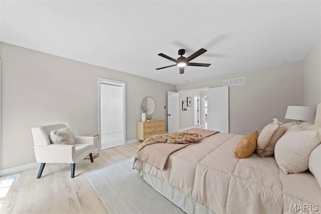 6 Freedom Way, Saint Charles, MO 63303 - bedroom featuring baseboards, wood finished floors, a ceiling fan, and connected bathroom