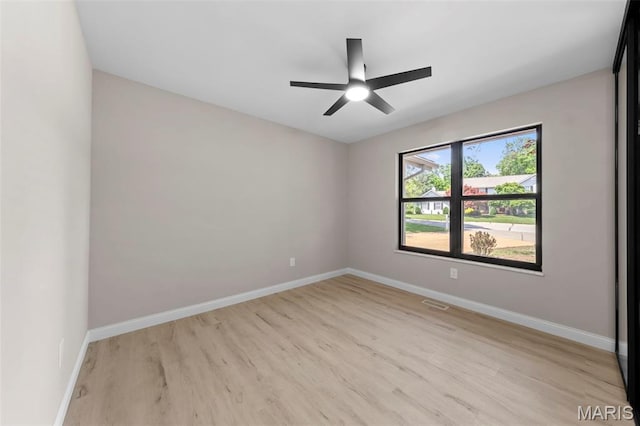 6 Freedom Way, Saint Charles, MO 63303 - empty room with baseboards, light wood-style floors, and a ceiling fan