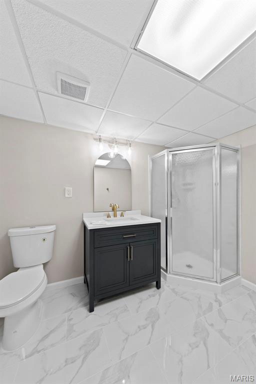 6 Freedom Way, Saint Charles, MO 63303 - full bathroom with vanity, toilet, marble finish flooring, a stall shower, and baseboards