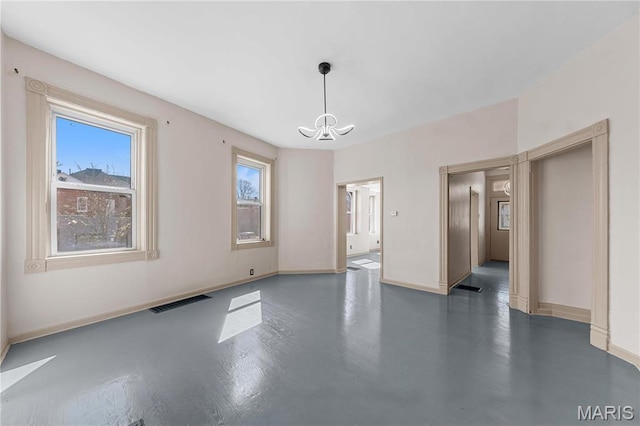 2901 Magnolia Ave, Saint Louis, MO 63118 - unfurnished room featuring a chandelier and baseboards