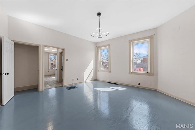 2901 Magnolia Ave, Saint Louis, MO 63118 - unfurnished dining area featuring healthy amount of natural light, a chandelier, and baseboards