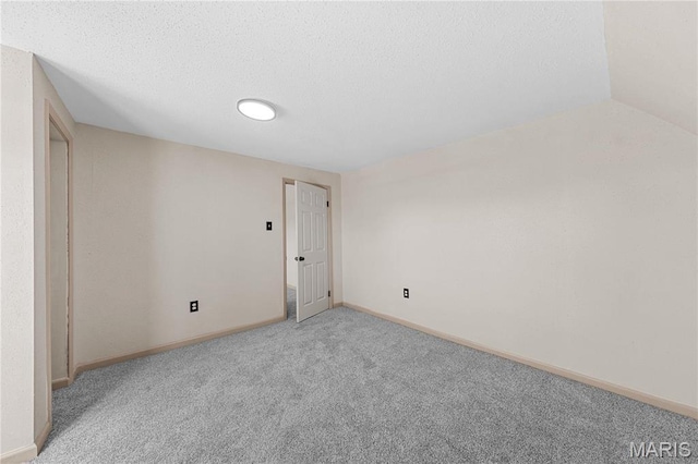 2901 Magnolia Ave, Saint Louis, MO 63118 - carpeted empty room featuring baseboards and a textured ceiling