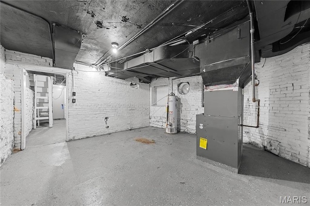 2901 Magnolia Ave, Saint Louis, MO 63118 - unfinished below grade area featuring gas water heater, brick wall, and heating unit