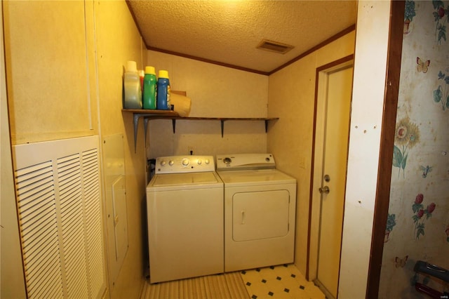 12433 State Route 101, Caulfield, MO 65626 - laundry room featuring washer and dryer, a textured ceiling, and light floors
