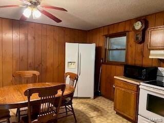 1742 Date Dr, Summersville, MO 65571 - kitchen with white appliances, brown cabinets, light flooring, under cabinet range hood, and ceiling fan