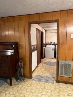 1742 Date Dr, Summersville, MO 65571 - hallway featuring light floors, washer / dryer, and wood walls