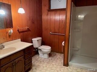 1742 Date Dr, Summersville, MO 65571 - full bathroom featuring a walk in shower, toilet, vanity, tile patterned floors, and wood walls