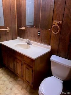 1742 Date Dr, Summersville, MO 65571 - bathroom with toilet, wood walls, vanity, and tile patterned floors