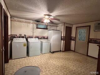 1742 Date Dr, Summersville, MO 65571 - laundry room with separate washer and dryer, light floors, ceiling fan, a wall mounted air conditioner, and a textured ceiling