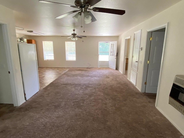 37 County Road 343, Benton Township, MO 65626 - unfurnished living room featuring carpet flooring, ceiling fan, and heating unit