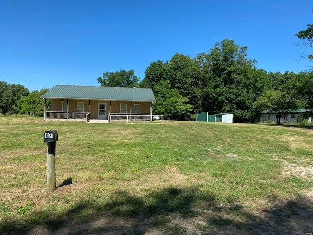 37 County Road 343, Benton Township, MO 65626 - view of front of property featuring covered porch, a front yard, and metal roof