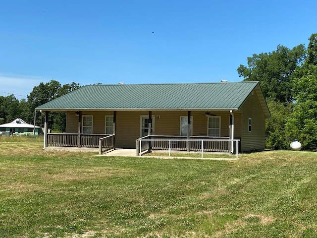 37 County Road 343, Benton Township, MO 65626 - view of front of house featuring ceiling fan, a front lawn, metal roof, and a patio area