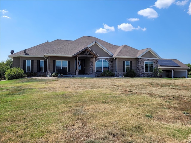 10359 Bounds Rd, Shipman, IL 62685 - view of front facade with stone siding, a front yard, and solar panels