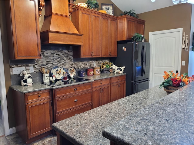 10359 Bounds Rd, Shipman, IL 62685 - kitchen with black appliances, custom exhaust hood, decorative backsplash, and dark stone counters