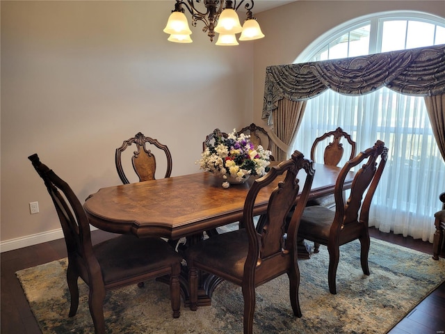 10359 Bounds Rd, Shipman, IL 62685 - dining space featuring a chandelier, hardwood / wood-style flooring, and baseboards