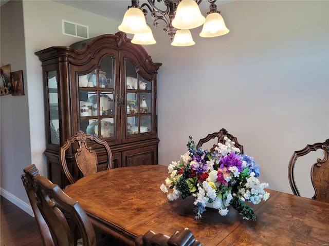 10359 Bounds Rd, Shipman, IL 62685 - dining room with a chandelier, wood finished floors, and baseboards